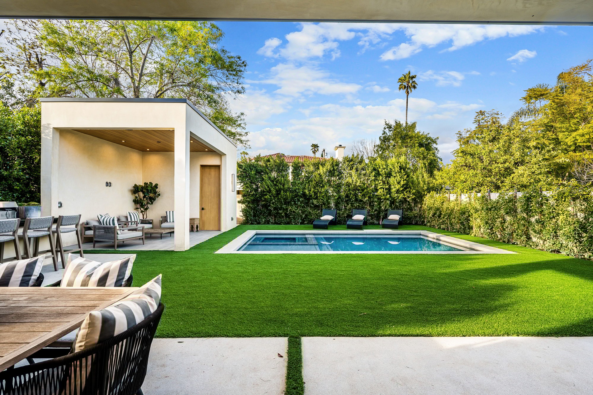 Modern backyard with pool and seating area